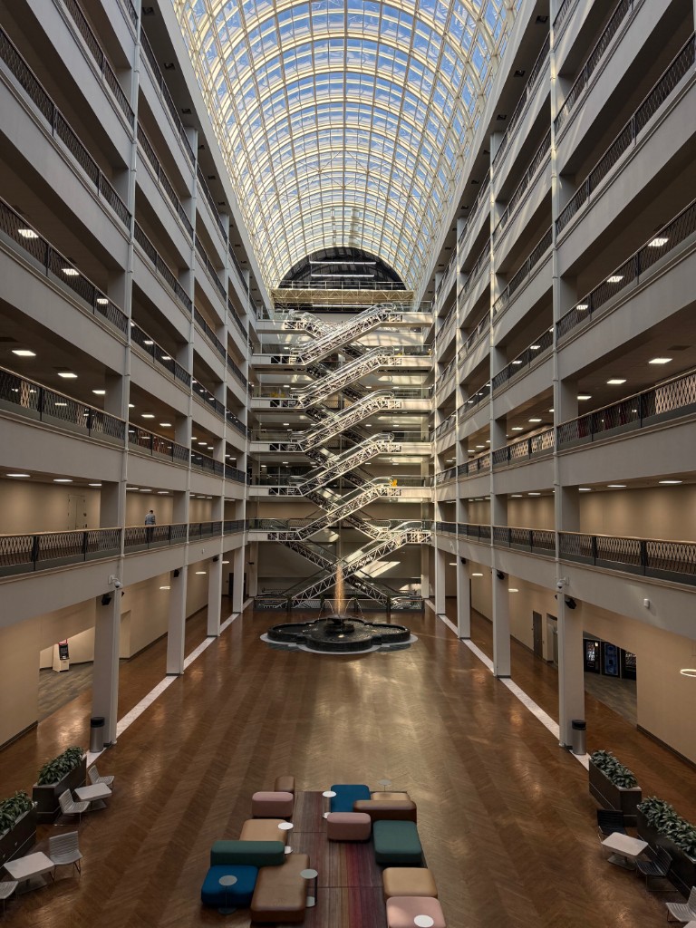 The Infomart's grand atrium with its distinctive glass ceiling and multi-story open design